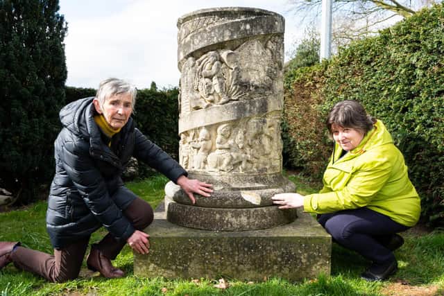 Coun Carol Milne (left) and Coun Alison Brown examine the damage to the Ribchester Millennium Column    photo: Kelvin Stuttard