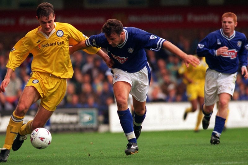 David Wetherall holds off Leicester City's Steve Walsh during the Premier League clash at Filbert Street in September 1996.