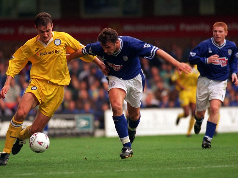 David Wetherall holds off Leicester City's Steve Walsh during the Premier League clash at Filbert Street in September 1996.