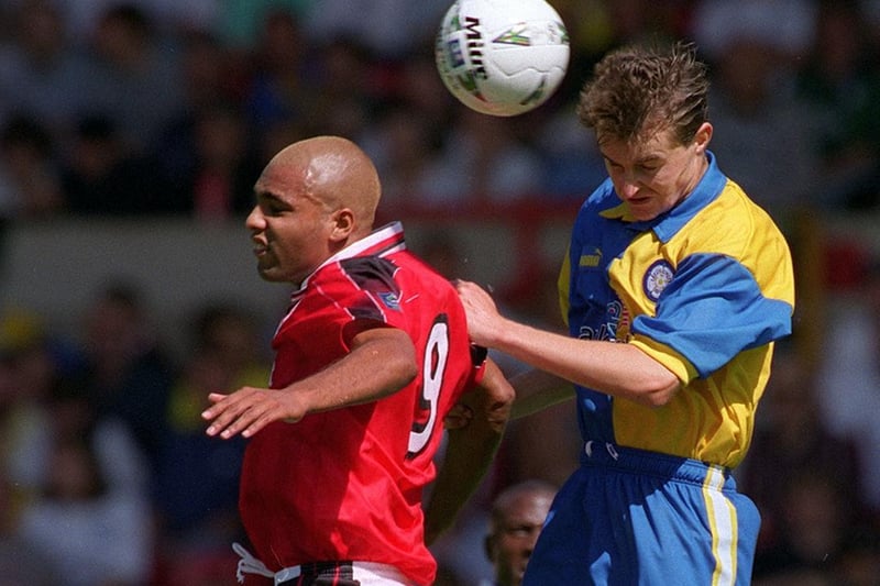 David Wetherall jumps to it with Nottingham Forest's Pierre van Hooijdonk during a pre-season friendly at the City Ground in August 1997.