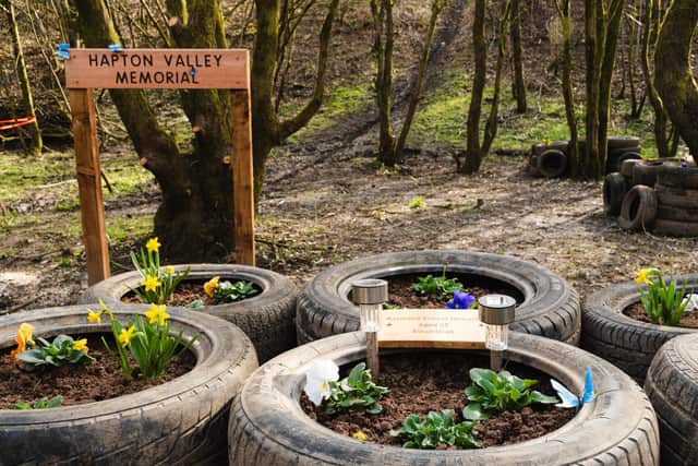 OId tyres dumped at the site have been recycled to create mine cart style flowerbeds