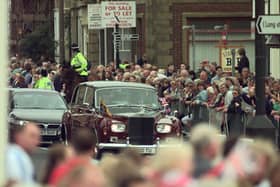 Crowds in Morecambe line the promenade to welcome The Queen and Prince Philip who were unveiling the Eric Morecambe statue in 1999.