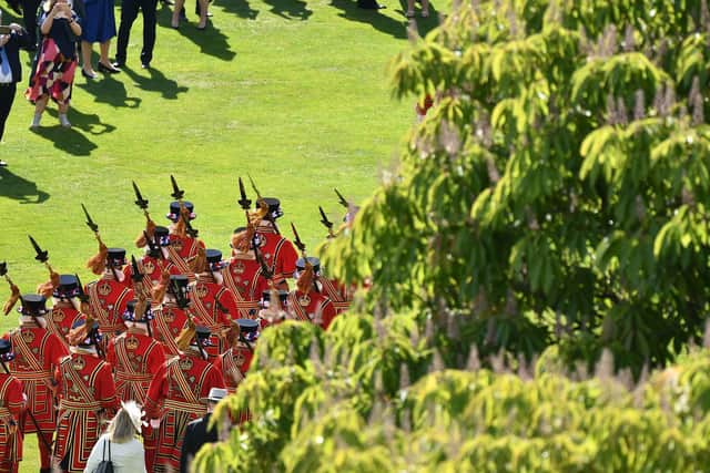 Yeomen of the Guard are seen at a garden party in the grounds of Buckingham Palace in central London on May 21, 2019