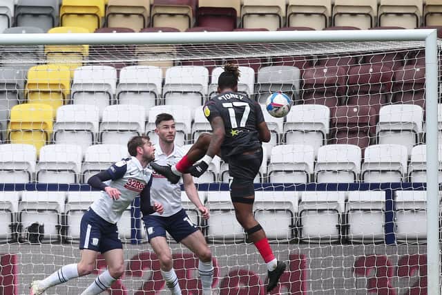 PNE's Tom Barkhuizen and Andrew Hughes can only watch as Ivan Toney heads Brentford's third goal at Deepdale