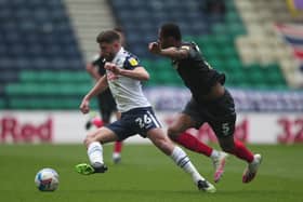 Ched Evans with Brentford’s Ethan Pinnock