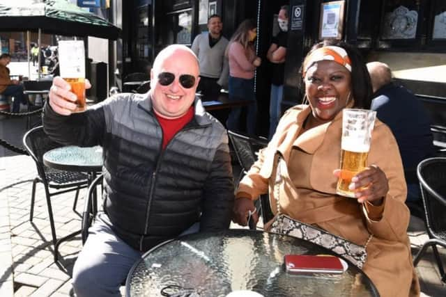 Catherine and David Scarfe enjoy an early morning drink at the Market Tavern.