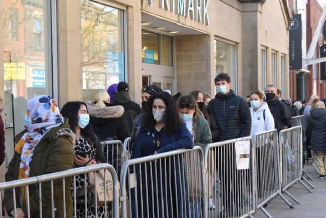 Shoppers queue outside Primark on Fishergate.