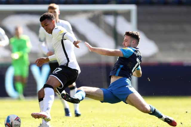 Preston North End midfielder Ben Whiteman makes a sliding challenge on Swansea's Morgan Whittaker at the Liberty Stadium