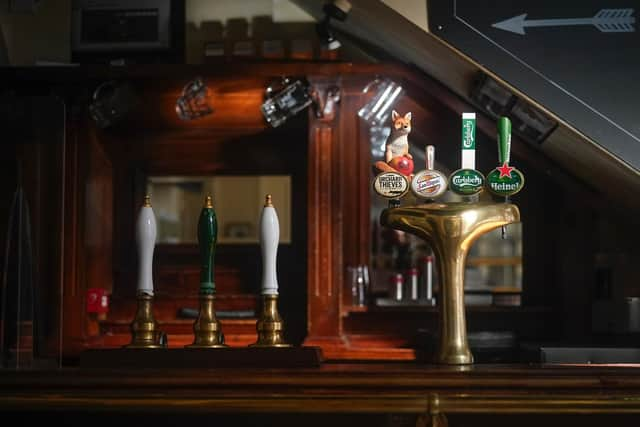 Beer pumps sit dormant in a pub during the pandemic lockdown in March.