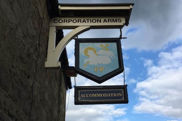 The Proud Preston coat of arms on the pub sign