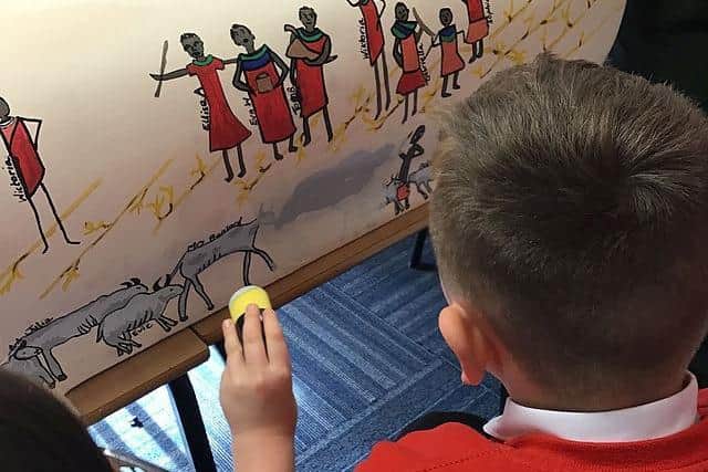 A St Gregory’s pupil works on the bench themed around Lila and the Secret of Rain