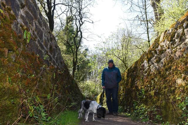 John Tracey and Molly walking on the cinder path