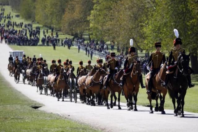 Soldiers from the Kings Troop Royal Horse Artillery make their way up The Long Walk at Windsor Castle before today's funeral service.
