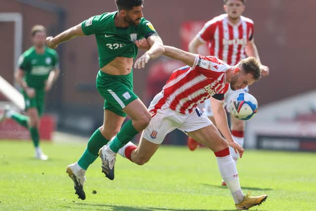 Ched Evans competes for the ball against Stoke