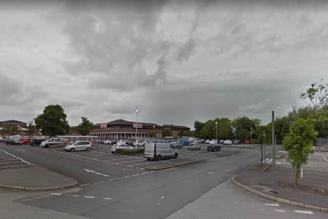 The two officers were filmed kissing by a shopper who spotted their romantic encounter taking place in the car park of the Tesco Superstore off Carl Fogarty Way, Blackburn on Friday, April 2. Pic: Google