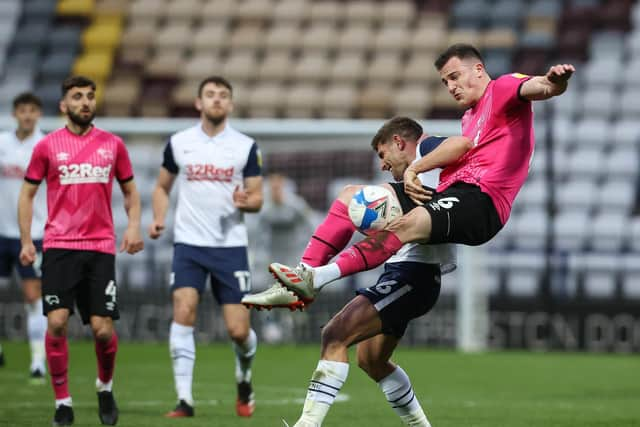 Ched Evans battles with Derby substitute George Edmundson