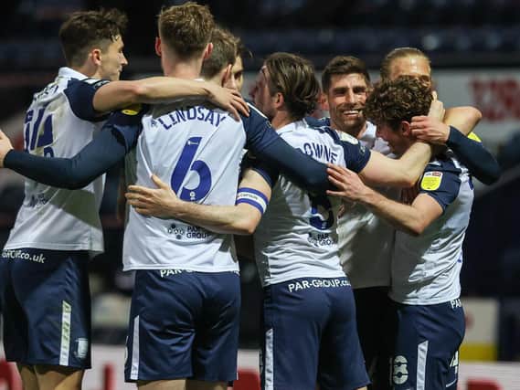 Preston North End's players celebrate Ryan Ledson scoring their third goal.