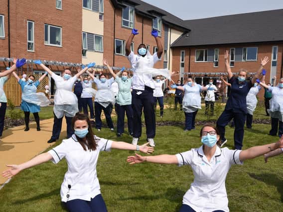 Now we are one - staff at the Sue Ryder Neurological Care Centre in Fulwood, Preston, celebrate their first anniversary Photo: Neil Cross