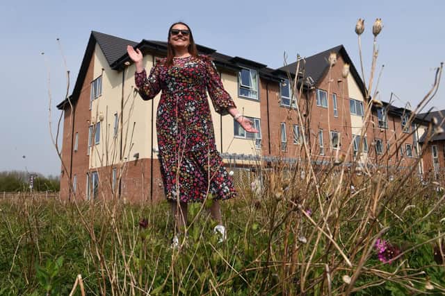 Fundraiser Michelle White pictured in the grounds of the Centre where it's hoped to create a sensory and wheelchair friendly garden Photo: Neil Cross