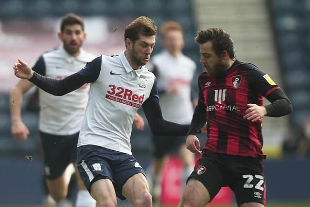 Tom Barkhuizen taking on former PNE man Ben Pearson during the game against Bournemouth