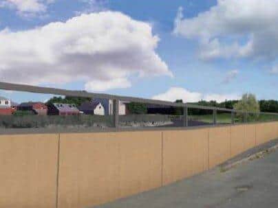 Some of the tallest defences will be topped with glass panels to maintain views across the Ribble, as imagined here on Riverside Road in Penwortham (image: Environment Agency)