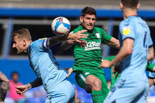 North End striker Ched Evans challenges Coventry skipper Kyle McFadzean