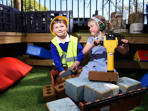 Noah and Ava at Treales C of E Primary School's improved infant outdoor area, photo: Neil Cross.