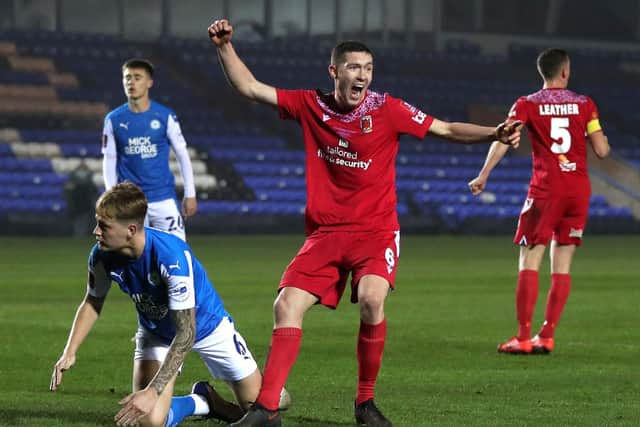 Lewis Baines celebrates scoring against Peterborough United