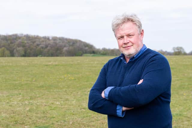 Nigel Geary pictured by the farmland where permission is being sought to extract gravel and sand        photo:Kelvin Stuttard
