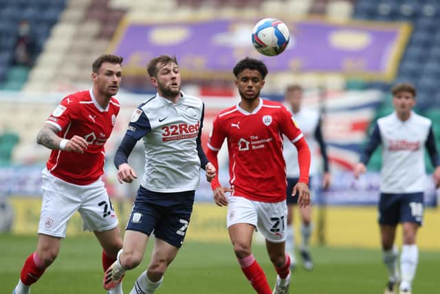 PNE's Tom Barkhuizen gets in front of Barnsley pair Michael Solbauer and Romal Palmer