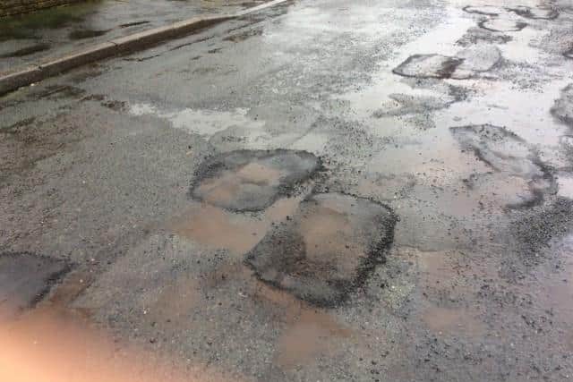 Daffodil Close residents want to see it resurfaced, not patched (image: Dave Carter)