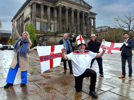 Football's coming home ... Mike Pixton, centre, with Serena Baxter, Paul Harrison, Paul Butcher and Richard Fontana on Preston's Flag Market