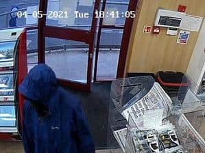 The man had reportedly been seen hanging around outside the store earlier in the day. (Credit: Lancashire Police)