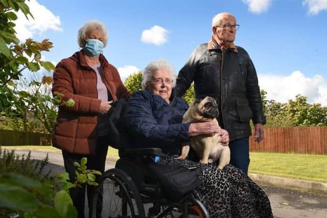 Mildred and Bill with their puppy Pugsley enjoy the outdoors following a change in guidance