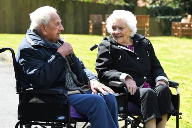 Residents Tom and Maria enjoy the outdoors at Highcliffe