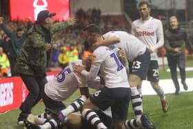 Preston North End players and fans celebrate Louis Moutl's winner at Nottingham Forest in December 2018