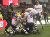 Preston North End players and fans celebrate Louis Moutl's winner at Nottingham Forest in December 2018