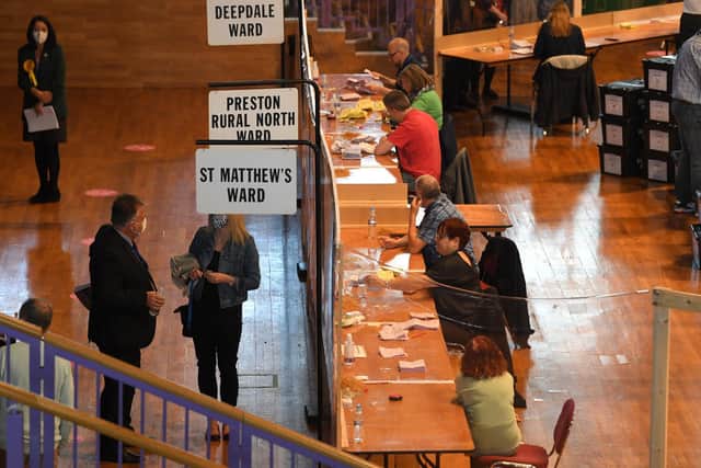 Some of the vote counters briefly got a shock from above when a bulb exploded during the vote verification process (image: Neil Cross)