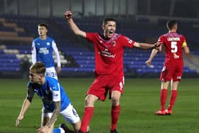 Lewis Baines celebrates scoring againstPeterborough in the FA Cup