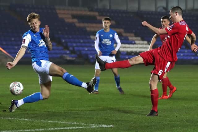 Lewis Baines lashes home the winner against Peterborough
