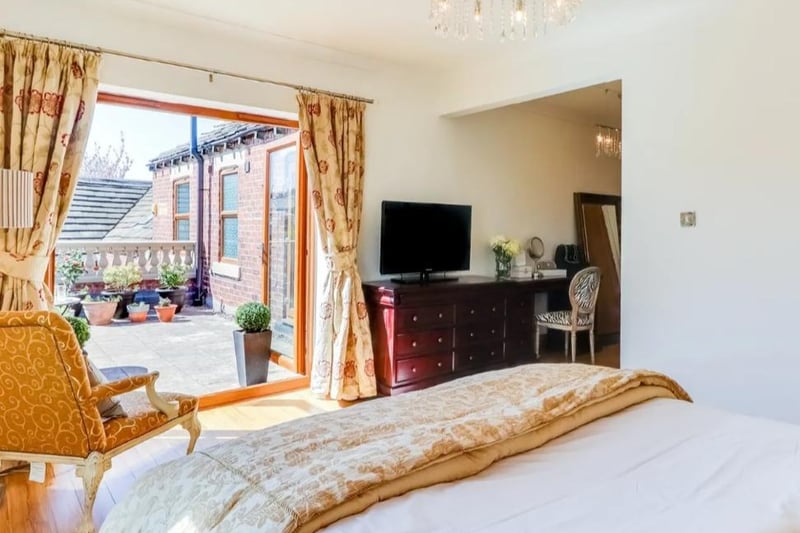 The bedroom area has laminate flooring and double glazed dual opening doors providing access to the roof terrace balcony.