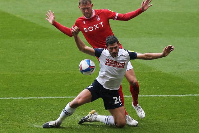 PNE striker Ched Evans is challenged by Forest's Joe Worrall