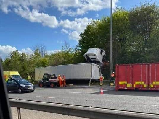 Police, fire crews and paramedics were calledto the sceneafter a white M&S lorry jackknifed and overturned following a crash with an Audi on the M6 near Preston. The crash caused the lorry to veer off the motorway andmountthe embankment.