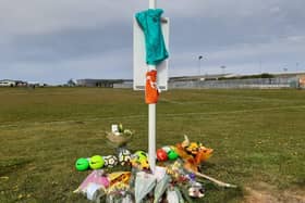 Nine footballs have left in tribute to 9-year-old Jordan Banks, who was struck by lightning during football training on the playing fields