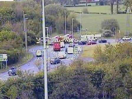 Emergency services at the scene of the crash on the M6 slip road at junction 31 near Salmesbury this morning (Thursday, May 13). Pic: Highways England