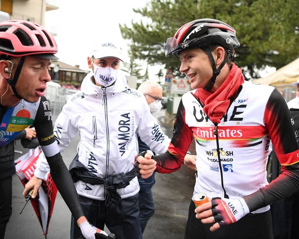 Hugh Carthy with Joe Dombrowski (right) who was unable to ride in stage six following his crash on Wednesday (Getty Images)