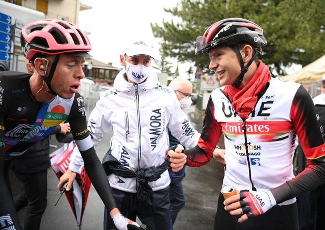 Hugh Carthy with Joe Dombrowski (right) who was unable to ride in stage six following his crash on Wednesday (Getty Images)