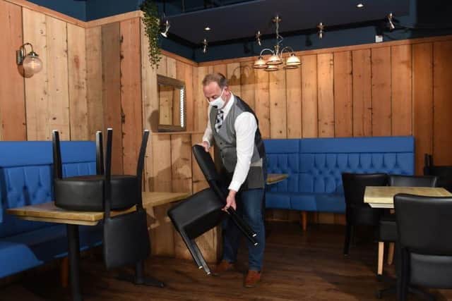 Tables are placed one metre apart ahead of indoors opening again on Monday