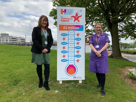 Head of charities at the Royal Preston Hospital Paula Wilson (left) with divisional nursing director for Children Jo Connolly as they unveil an appeal barometer for the Lancashire Teaching Hospitals Charity’s Children’s Appeal