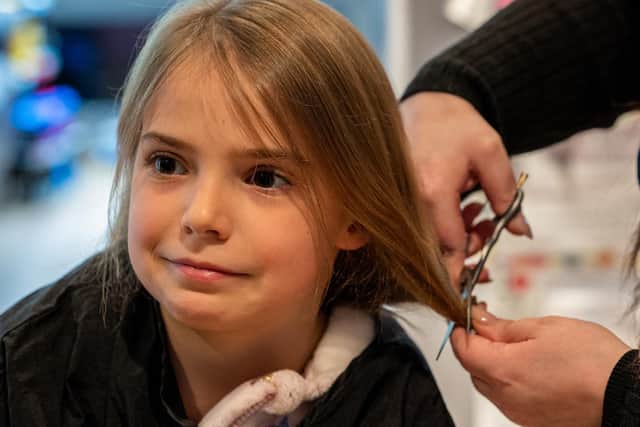 Eden Heslop braves the scissors for charity. Photos: Ian Heslop.